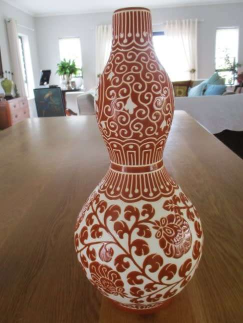 LARGE CORAL RED CHINESE DOUBLE GOURD VASE WITH CHINESE SYMBOLS AND FLORAL DESIGN - SIGNED