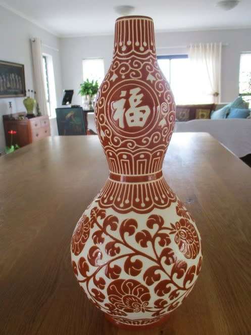 LARGE CORAL RED CHINESE DOUBLE GOURD VASE WITH CHINESE SYMBOLS AND FLORAL DESIGN - SIGNED