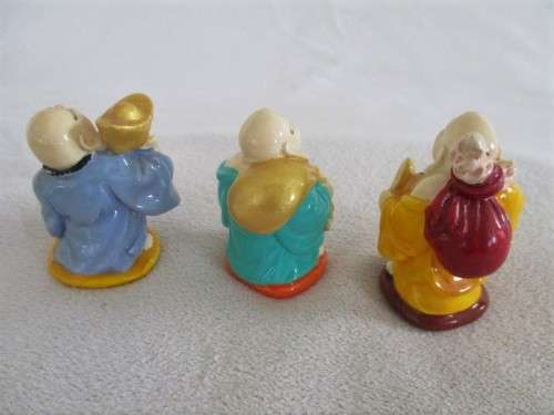 A SET OF SIX COLOURFUL AND JOLLY LITTLE BUDDHAS - THREE SITTING AND THREE STANDING