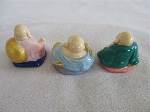A SET OF SIX COLOURFUL AND JOLLY LITTLE BUDDHAS - THREE SITTING AND THREE STANDING