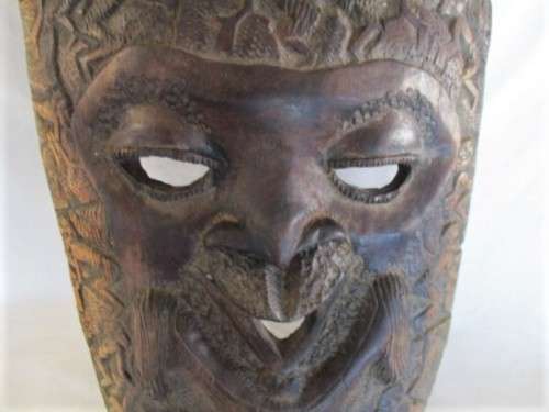 AN UNUSUAL VERY LARGE INTRICATELY CARVED WOODEN AFRICAN MASK