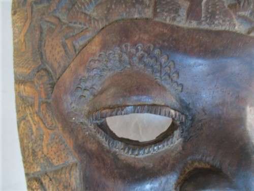 AN UNUSUAL VERY LARGE INTRICATELY CARVED WOODEN AFRICAN MASK