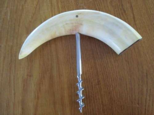 GOOD QUALITY JAPANESE STAINLESS STEEL KNIFE AND A CORKSCREW MADE FROM WARTHOG TUSKS
