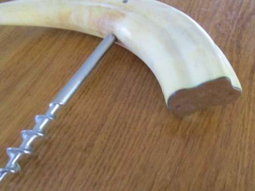 GOOD QUALITY JAPANESE STAINLESS STEEL KNIFE AND A CORKSCREW MADE FROM WARTHOG TUSKS