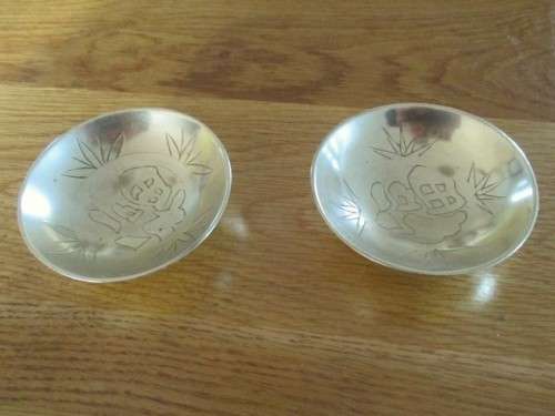 TWO SMALL VINTAGE CHINESE BRASS BOWLS/DISHES WITH GOOD LUCK SYMBOLS (PLEASE DISREGARD REFLECTIONS)