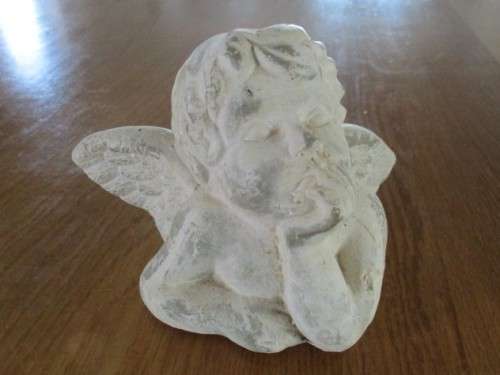 A HEAVY STONE CAST CHERUB  HEAD