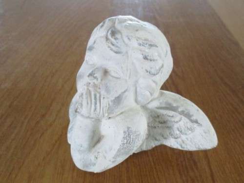 A HEAVY STONE CAST CHERUB  HEAD