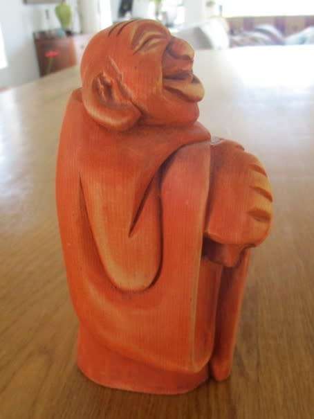 A CUTE 18CM TALL WOODEN BUDDHA WITH LARGE HANDS - UNUSUAL COLOUR