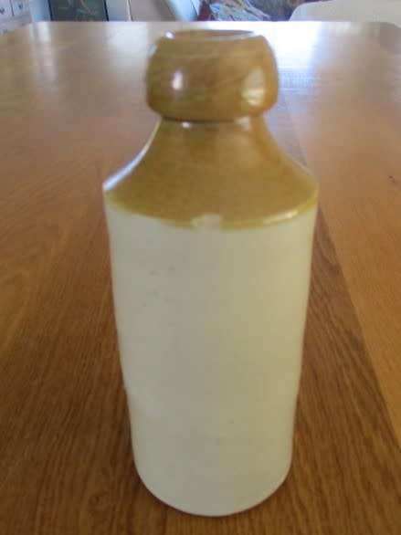 AN ANTIQUE STONEWARE GINGER BEER BOTTLE - HEINR KAMP PORT ELIZABETH - CIRCA 1914 TO 1919