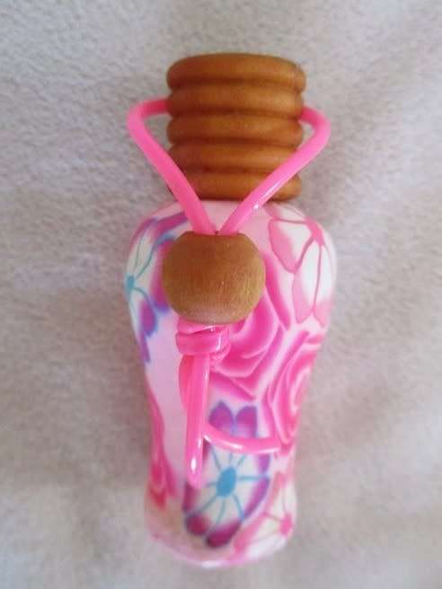 TWO PRETTY PERFUME BOTTLES WITH WOODEN LIDS TO ADD TO YOUR COLLECTION