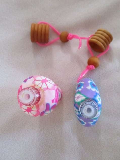 TWO PRETTY PERFUME BOTTLES WITH WOODEN LIDS TO ADD TO YOUR COLLECTION