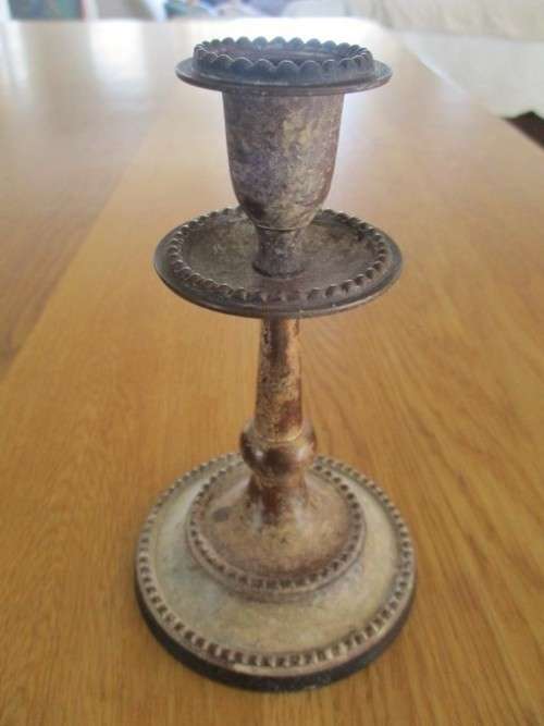 TWO OLD METAL CANDLESTICKS MADE IN INDIA WITH LOADS OF CHARACTER
