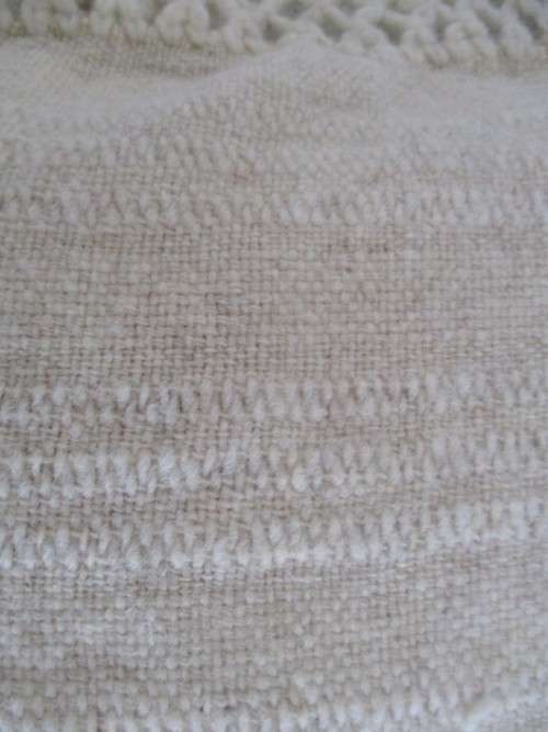 A  LOVELY MOHAIR CUSHION WITH CROTCHETED BORDER