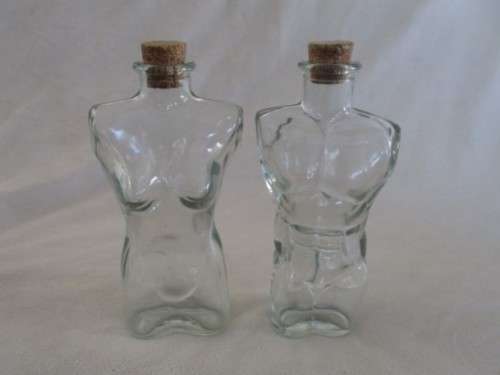 TWO UNUSUAL MALE AND FEMALE TORSO LUTEX GLASS BOTTLES