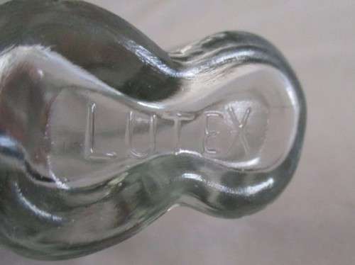 TWO UNUSUAL MALE AND FEMALE TORSO LUTEX GLASS BOTTLES