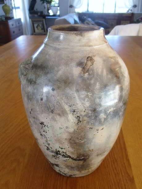 THERE IS SOMETHING SO NOT AVERAGE ABOUT THIS LARGE, HEAVY, BEAUTIFULLY GLAZED VASE