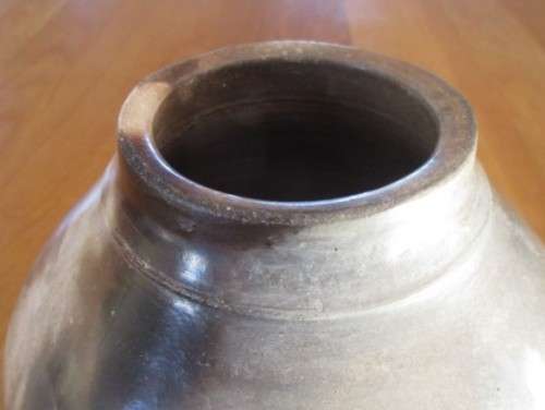 THERE IS SOMETHING SO NOT AVERAGE ABOUT THIS LARGE, HEAVY, BEAUTIFULLY GLAZED VASE