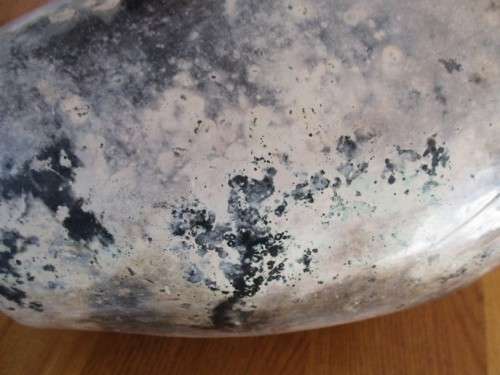 THERE IS SOMETHING SO NOT AVERAGE ABOUT THIS LARGE, HEAVY, BEAUTIFULLY GLAZED VASE