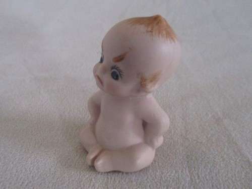 THIS CUTE LITTLE VINTAGE BISQUE KEWPIE IS NOT HAPPY!!