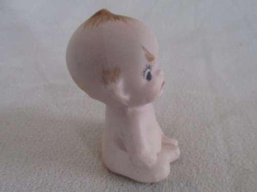THIS CUTE LITTLE VINTAGE BISQUE KEWPIE IS NOT HAPPY!!
