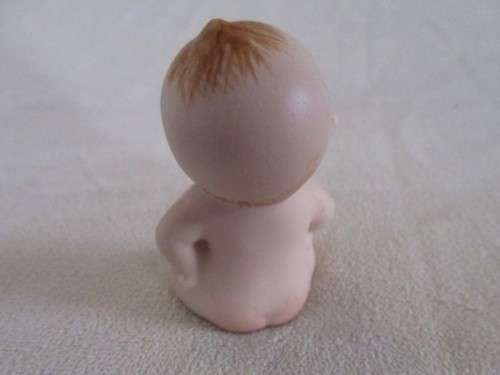 THIS CUTE LITTLE VINTAGE BISQUE KEWPIE IS NOT HAPPY!!