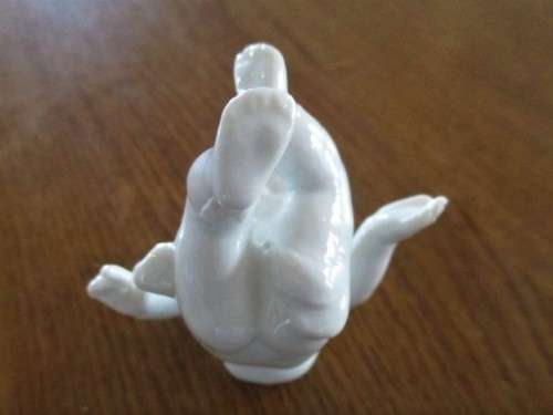 TWO VINTAGE PORCELAIN FROLICKING CHILDREN