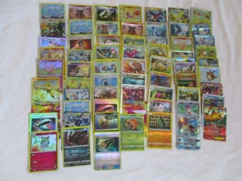 ONE BID FOR ALL - OVER 1200 POKEMON CARDS WITH 66 FOIL, 77 HOLO, 1 "REDEEM YOUR REWARDS", AND 5 TINS