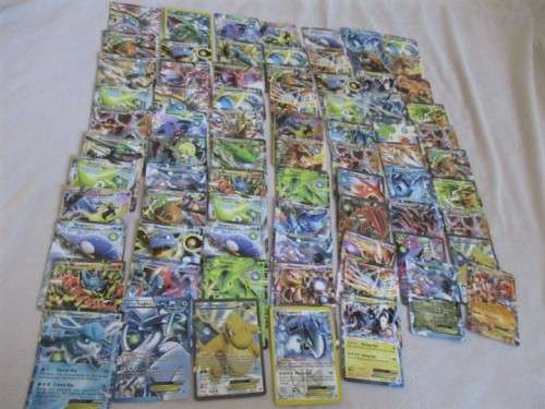 ONE BID FOR ALL - OVER 1200 POKEMON CARDS WITH 66 FOIL, 77 HOLO, 1 "REDEEM YOUR REWARDS", AND 5 TINS