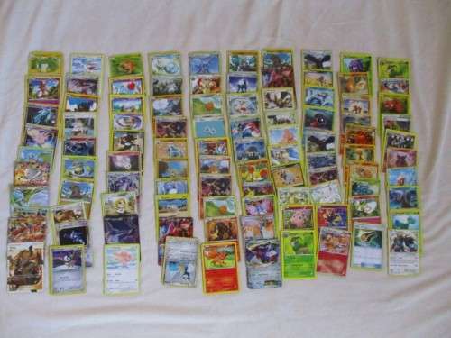 ONE BID FOR ALL - OVER 1200 POKEMON CARDS WITH 66 FOIL, 77 HOLO, 1 "REDEEM YOUR REWARDS", AND 5 TINS