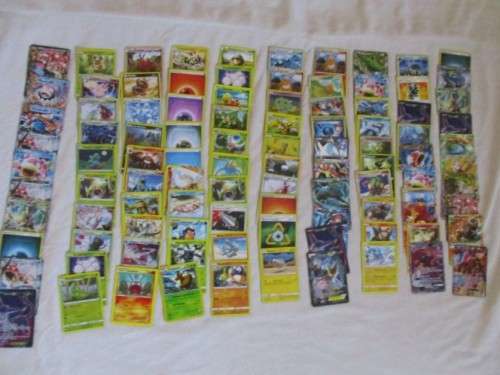 ONE BID FOR ALL - OVER 1200 POKEMON CARDS WITH 66 FOIL, 77 HOLO, 1 "REDEEM YOUR REWARDS", AND 5 TINS