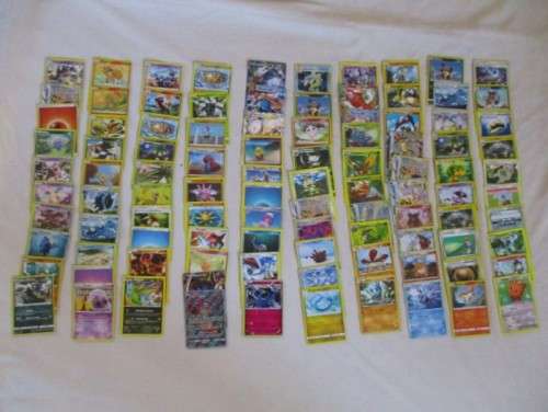 ONE BID FOR ALL - OVER 1200 POKEMON CARDS WITH 66 FOIL, 77 HOLO, 1 "REDEEM YOUR REWARDS", AND 5 TINS