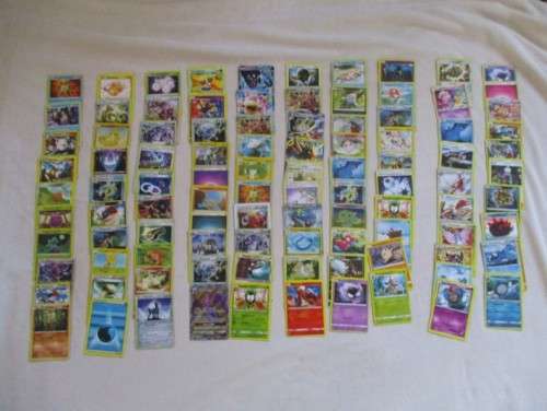 ONE BID FOR ALL - OVER 1200 POKEMON CARDS WITH 66 FOIL, 77 HOLO, 1 "REDEEM YOUR REWARDS", AND 5 TINS