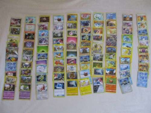 ONE BID FOR ALL - OVER 1200 POKEMON CARDS WITH 66 FOIL, 77 HOLO, 1 "REDEEM YOUR REWARDS", AND 5 TINS