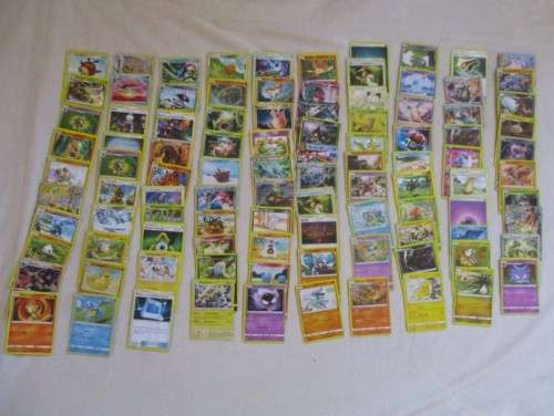 ONE BID FOR ALL - OVER 1200 POKEMON CARDS WITH 66 FOIL, 77 HOLO, 1 "REDEEM YOUR REWARDS", AND 5 TINS