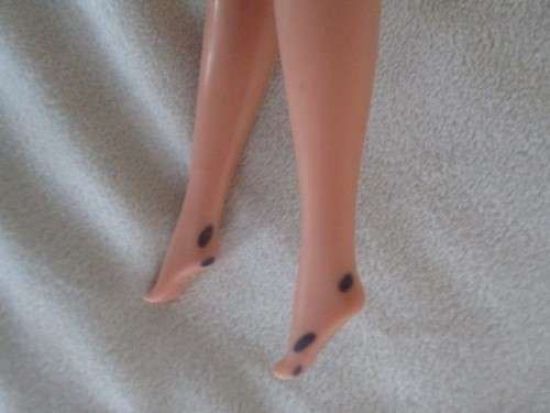 A VINTAGE MATTEL BARBIE DOLL WITH MINOR IMPERFECTIONS