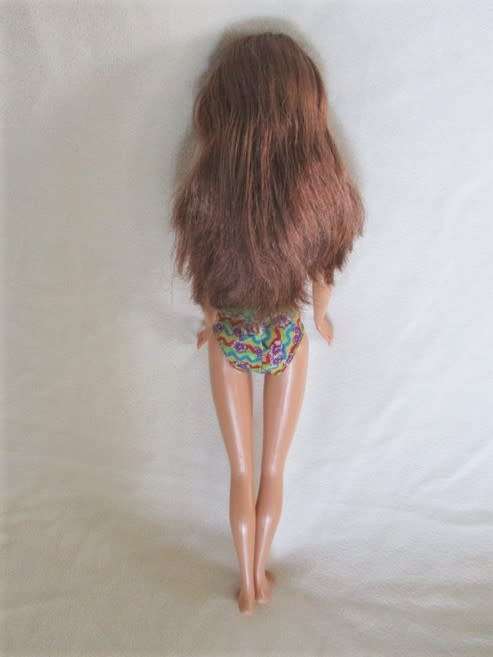 PRETTY DARK HAIRED MATTEL BARBIE DOLL WITH FLAT FEET