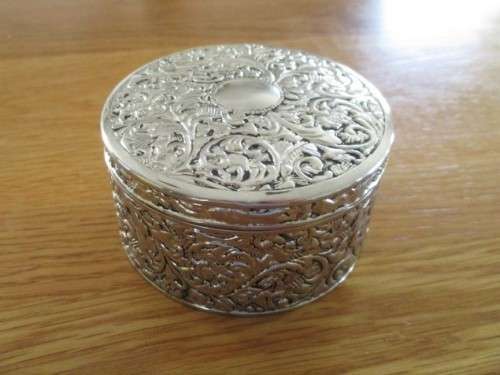 VERY DECORATIVE SILVER METAL TRINKET BOX WITH RED VELVET LINING (PLEASE DISREGARD REFLECTIONS)