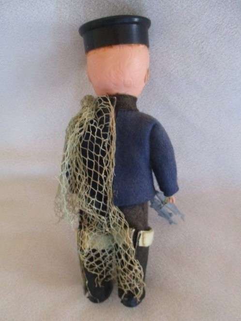A SMALL  VINTAGE ROSEBUD, ENGLAND DOLL - CORNWALL FISHERMAN IN ORIGINAL OUTFIT WITH FISH AND NET