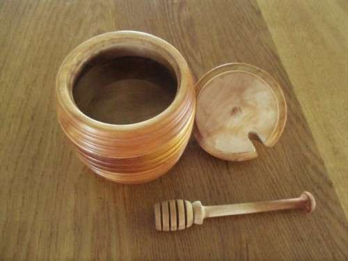 A BEAUTIFUL SOLID TURNED WOOD HONEY POT WITH PROPER HONEY SPOON