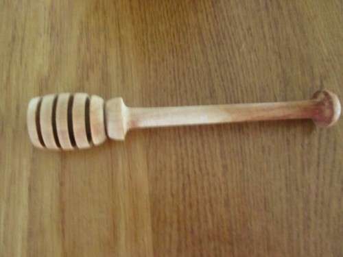 A BEAUTIFUL SOLID TURNED WOOD HONEY POT WITH PROPER HONEY SPOON