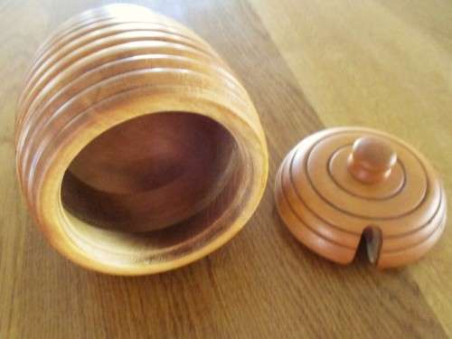 A BEAUTIFUL SOLID TURNED WOOD HONEY POT WITH PROPER HONEY SPOON