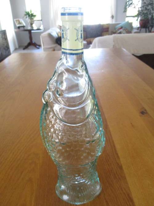 VINTAGE FISH-SHAPED BOTTLE FROM MARINER`S WHARF HOUT BAY
