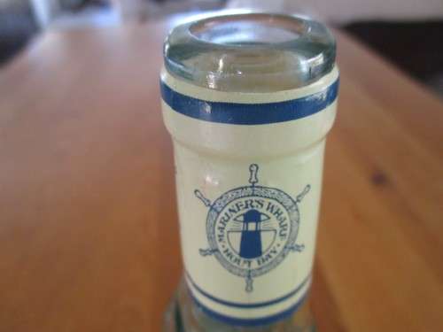 VINTAGE FISH-SHAPED BOTTLE FROM MARINER`S WHARF HOUT BAY