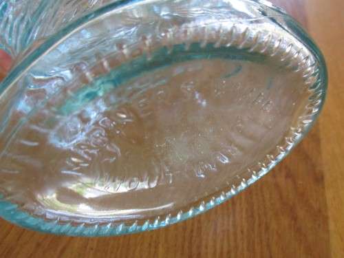 VINTAGE FISH-SHAPED BOTTLE FROM MARINER`S WHARF HOUT BAY