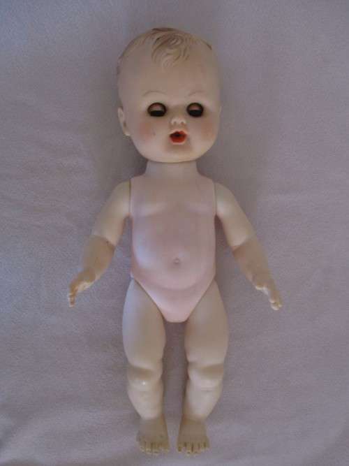 A CUTE BUT NOT PERFECT VINTAGE DOLL