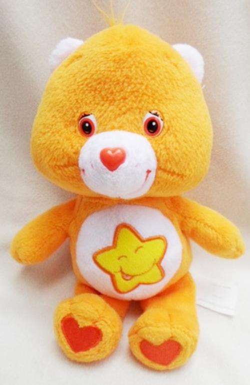 A CUTE LITTLE ORANGE CARE BEAR!!