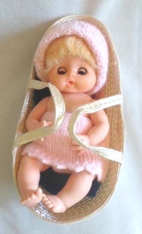 CUTE LITTLE VINTAGE DOLLY MARKED 'SAD' ON BACK IN CARRY BASKET!!