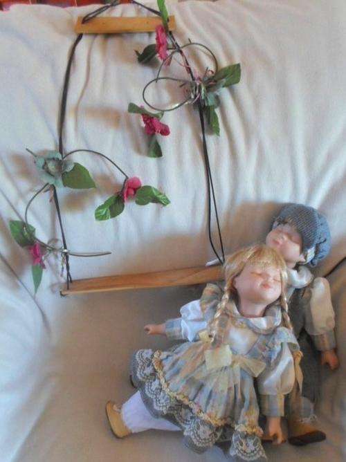 TWO PORCELAIN DOLLS PLUS SWING!!