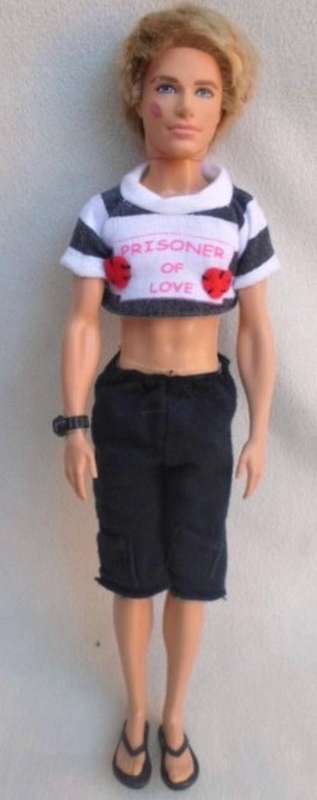 HOW'S THIS HUNKY MATTEL DOLL WITH LIPSTICK ON HIS CHEEK AND 'PRISONER OF LOVE' T-SHIRT??