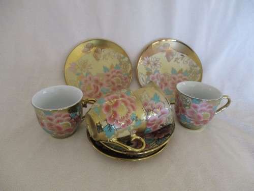 A SPECIAL DINNER? FOUR EXQUISITE GILT, FLORAL AND BUTTERFLY CUPS AND SAUCERS FOR AFTER DINNER COFFEE